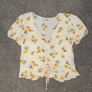 American Eagle yellow shirt with flowers and cinch